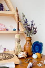 Mini Witch's Broom on Altar with herbs and crystals