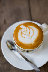 hot coffee in mug on wood table
