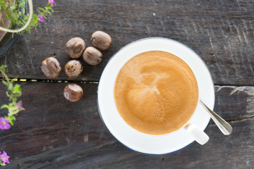 Hot coffee cup on wooden table