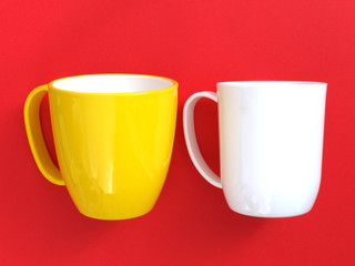 yellow cup and white cup