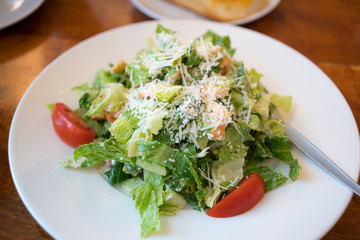 Fresh healthy  Caesar salad on white plate