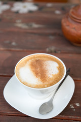 Hot coffee cup on wooden table
