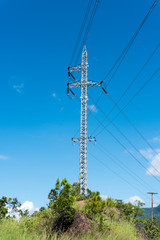 Obraz premium Electrician stays on the tower pole