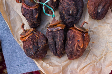 Sweet dried persimmons. Homemade and sun dried asian Japanese fruit. Healthy organic dessert