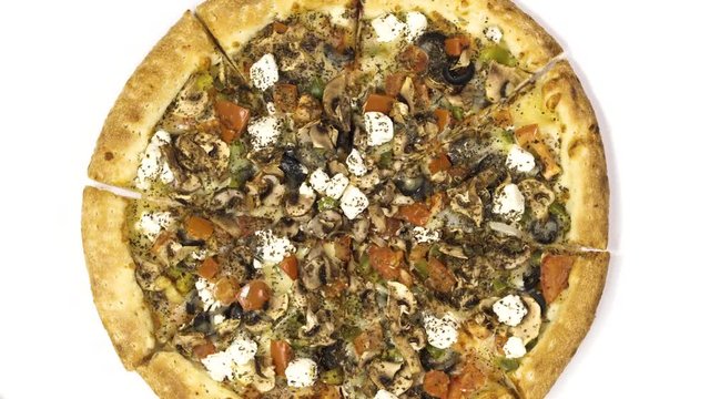 Rotating pizza with smoked sausage and olives on a white background. Top view center orientation