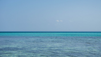 transparent and clear blue green sea with clear sky in karimun jawa