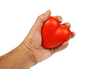 Red heart shape in hand on white background. Conceptual image.