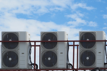 air conditioners on the roof. background blue sky