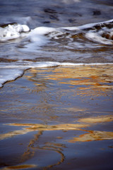 Water and waves on the beach at Coffs Harbour NSW