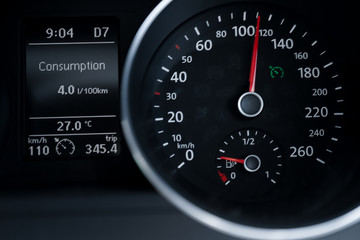 A Modern Car odometer Cluster with LCD Multifunction Display. Meter at constant speed show the fuel consumption efficiency 