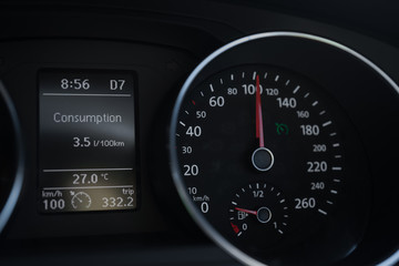 A Modern Car odometer Cluster with LCD Multifunction Display. Meter at constant speed show the fuel...