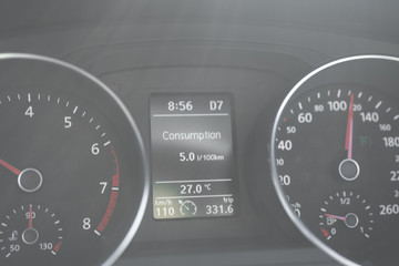 A Modern Car odometer Cluster with LCD Multifunction Display. Meter at constant speed show the fuel...