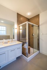Luxury bright bathroom with a shower cabin. Interior design.
