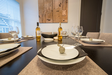 Bright dining room table set for dinner. Interior design.
