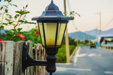 Lonely lantern on a wooden fence in a South Korean village