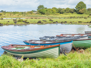 Naklejka na ściany i meble Boats Near Annaghkeen Pier in Ireland