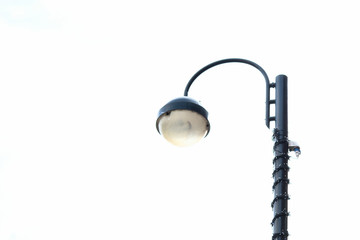 Close-up of street light against white background 