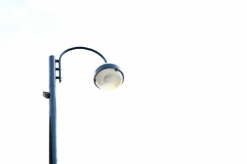 Close-up of street light against white background 