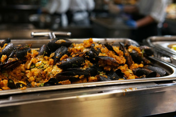 mussels baked with vegetables in the kitchen of the restaurant