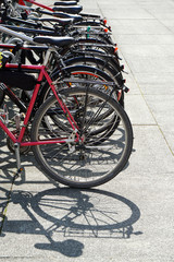 Obraz premium row of bikes parked at a bicycle stand or rack 