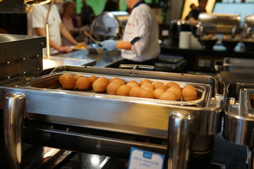 the Cook prepares the eggs in the kitchen of the restaurant nice