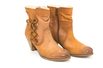 Women's autumn shoes made of genuine brown leather with laces on an isolated background. Spring shoes with heels 