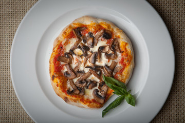 mushrooms pizza on a white plate