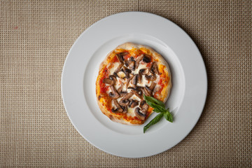 mushrooms pizza on a white plate
