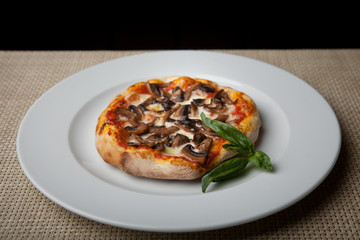 mushrooms pizza on a white plate