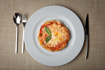 cheese pizza on a white plate