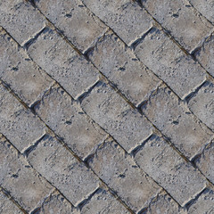 Seamless photo texture of concrete bricks with fragments of moss