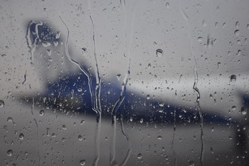 Rain drops on window of an aircraft
