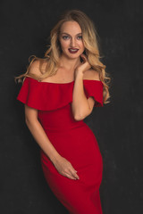 Fototapeta premium Pretty woman wearing beautiful red dress. 