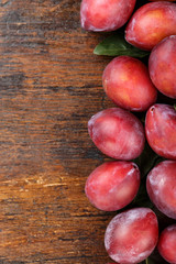 plum on a wooden background place for text