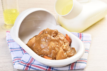 Curry with rice on a plate of shape of toilet