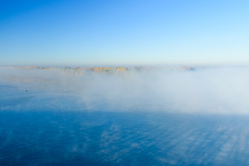 Fog over the water on a river Dnieper on autumn