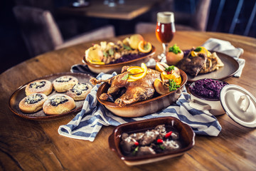 Roasted christmas duck red cabbage dumplings liver draft beer and baked buns.