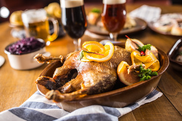 Roasted christmas duck red cabbage dumplings liver draft beer and baked buns.