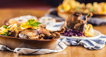 Roasted christmas duck leg red cabbage dumplings liver draft beer and baked buns