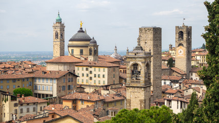 Obraz premium Bergamo, Italy. The old town. Landscape at the city center, the old towers and the clock towers from the ancient fortress