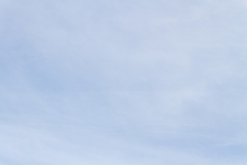 Blue sky with white porous clouds in summer