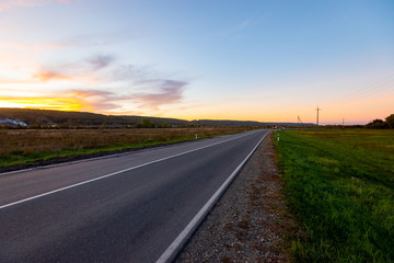 Scenic view of a new road through autumn trees