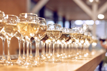 rows of wine glasses on corporate party celebration