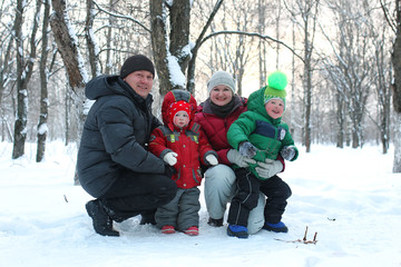 Young family with children in winter