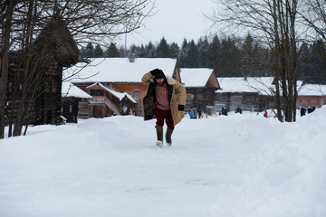 Traditional winter costume of peasant medieval age in russia