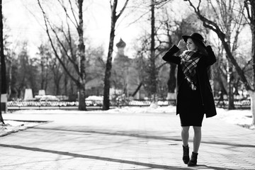 Black and white photo of a young girl on a walk