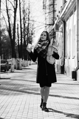 Black and white photo of a young girl on a walk