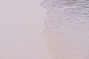 Wave of the sea on the sand beach