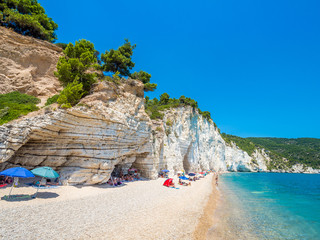 APULIA, IT - Jul 19, 2018: Mattinata Faraglioni stacks and beach coast of Baia Delle Zagare, Vieste...