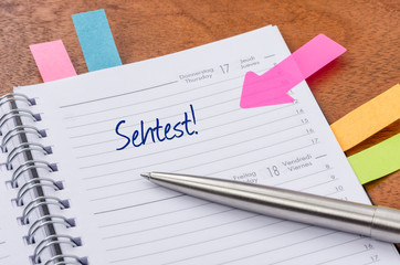 Terminkalender mit Hinweissticker - Sehtest